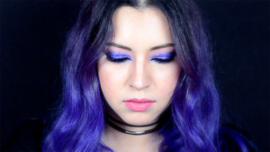 Ella anchor - Madness Music Video - Purple hair and makeup