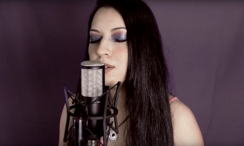 Ella Anchor - singing on microphone
